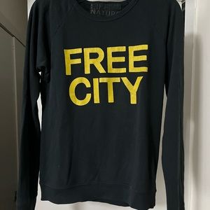 FREE CITY black crew neck with yellow writing size 0/XS